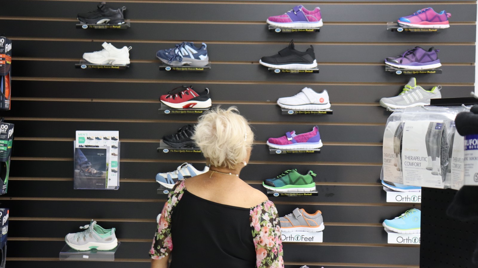 Woman looking on shoe display